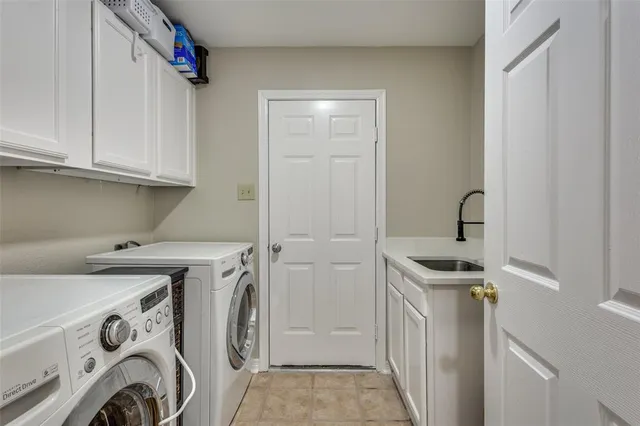 a view of storage and utility room with washer and dryer