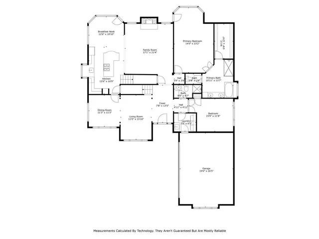 a front view of a house with a garden and yard