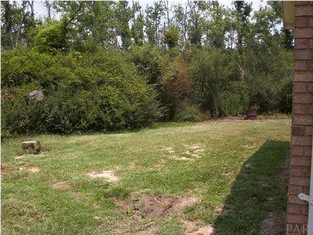 6380 Brickyard Road Molino, FL 32577 - Photo 12 of 17 Standing and facing front of home at left corner - This is the Lefthand side of the house.