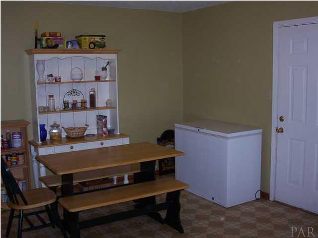 6380 Brickyard Road Molino, FL 32577 - Photo 2 of 17 A view of the dining/breakfast area from kitchen. The door on right leads to the backyard.