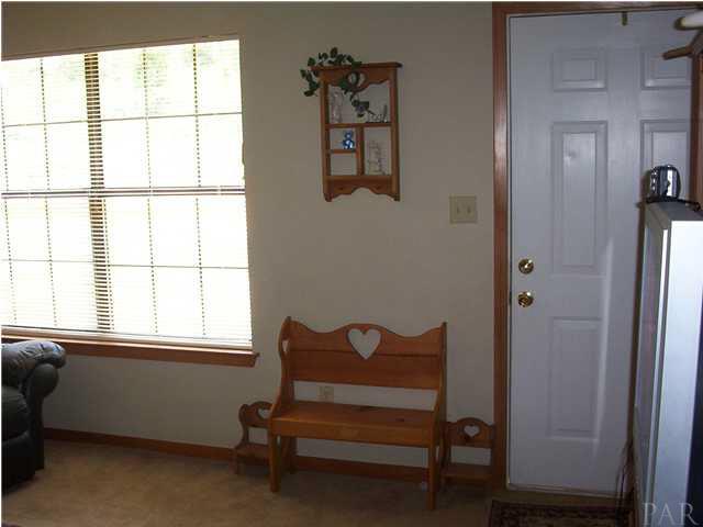 6380 Brickyard Road Molino, FL 32577 - Photo 4 of 17 Quick little portion of the family room with a generous window allowing plenty of sunshine and/or holiday lights to be displayed!