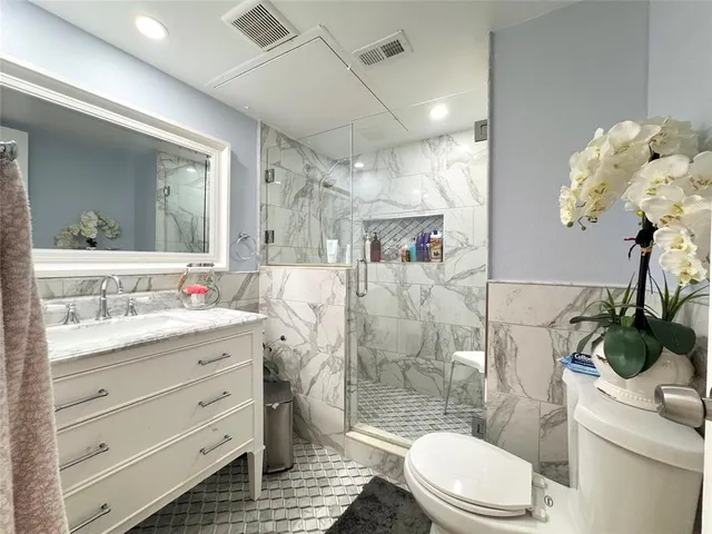 a bedroom with a bed and a closet