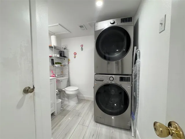 a bathroom with a sink toilet and a mirror