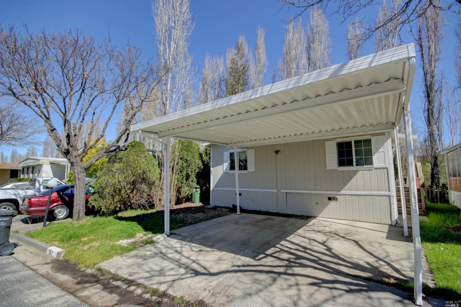a view of a house with a yard and garage
