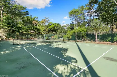 a view of a patio with swimming pool table and chairs