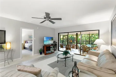 a living room with furniture or couches and a large window