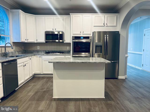 3135 Floating Leaf Lane Waldorf, MD 20603 - Photo 11 of 100 a kitchen with stainless steel appliances granite countertop a refrigerator a stove a sink and white cabinets with wooden floor