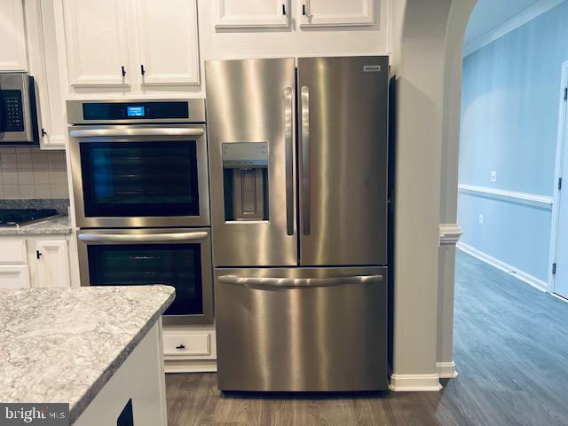 3135 Floating Leaf Lane Waldorf, MD 20603 - Photo 15 of 100 a kitchen with granite countertop a refrigerator stove and microwave