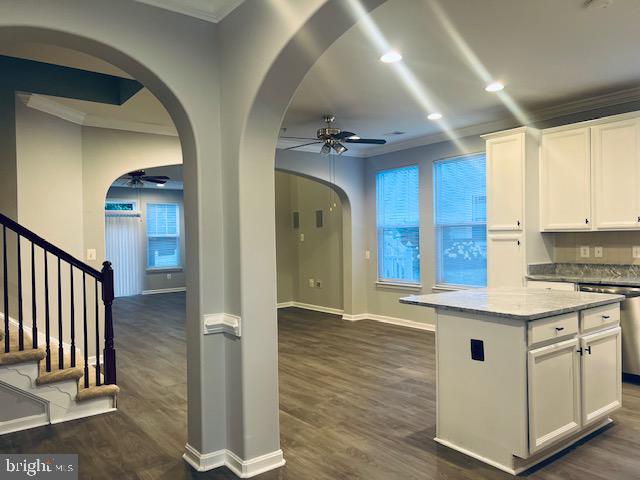 3135 Floating Leaf Lane Waldorf, MD 20603 - Photo 16 of 100 a kitchen with stainless steel appliances granite countertop a white cabinets and wooden floor