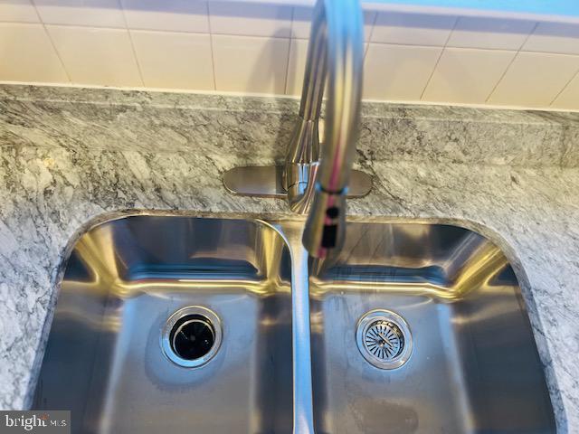 3135 Floating Leaf Lane Waldorf, MD 20603 - Photo 19 of 100 a bathroom with a sink and a washing machine