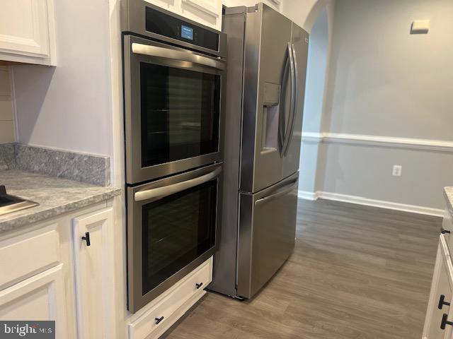 3135 Floating Leaf Lane Waldorf, MD 20603 - Photo 22 of 100 a kitchen with granite countertop cabinets and refrigerator
