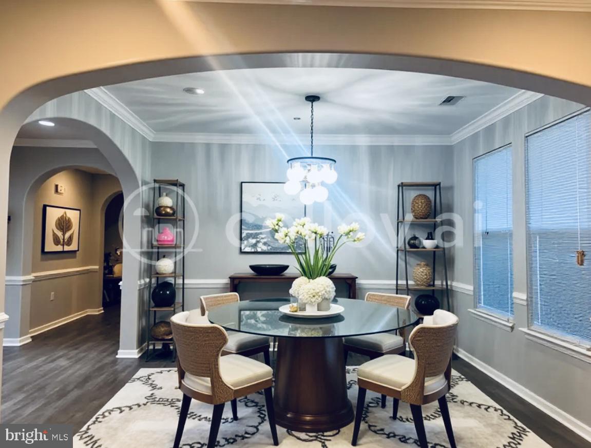 3135 Floating Leaf Lane Waldorf, MD 20603 - Photo 4 of 100 a dining room with furniture a chandelier and wooden floor