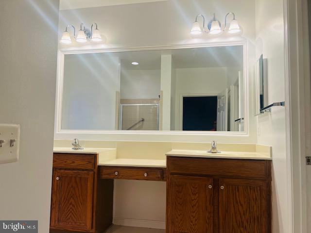 3135 Floating Leaf Lane Waldorf, MD 20603 - Photo 42 of 100 a bathroom with a sink and a mirror