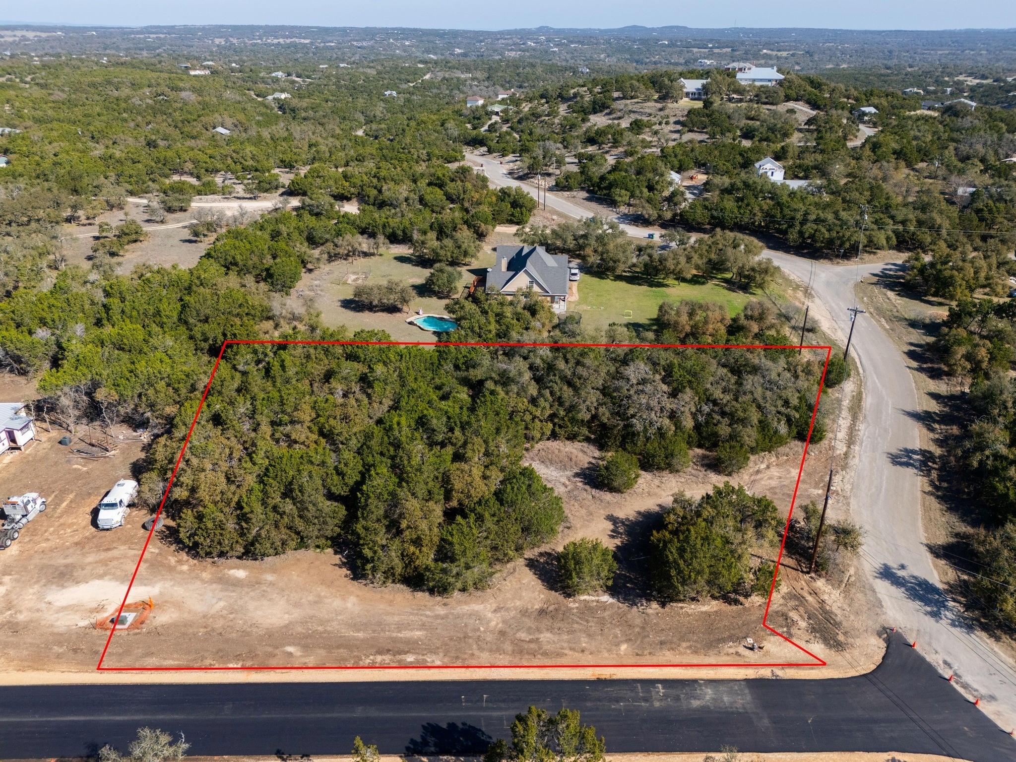 Lot-1 Lot-1 Spring Dripping Springs, TX 78620 - Photo 2 of 9 an aerial view of residential houses with outdoor space and trees
