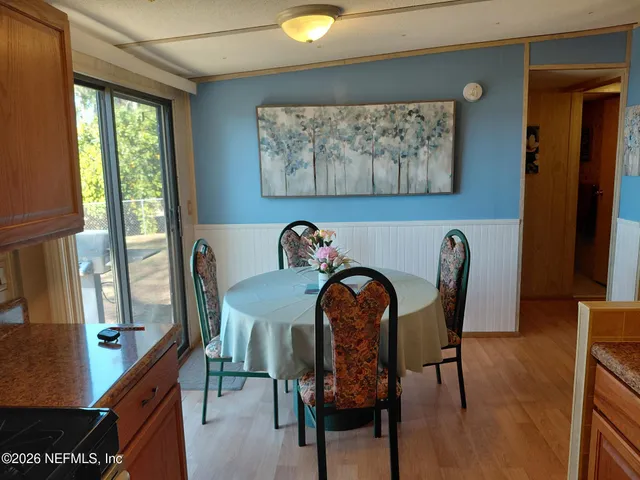 a kitchen with a sink and a refrigerator