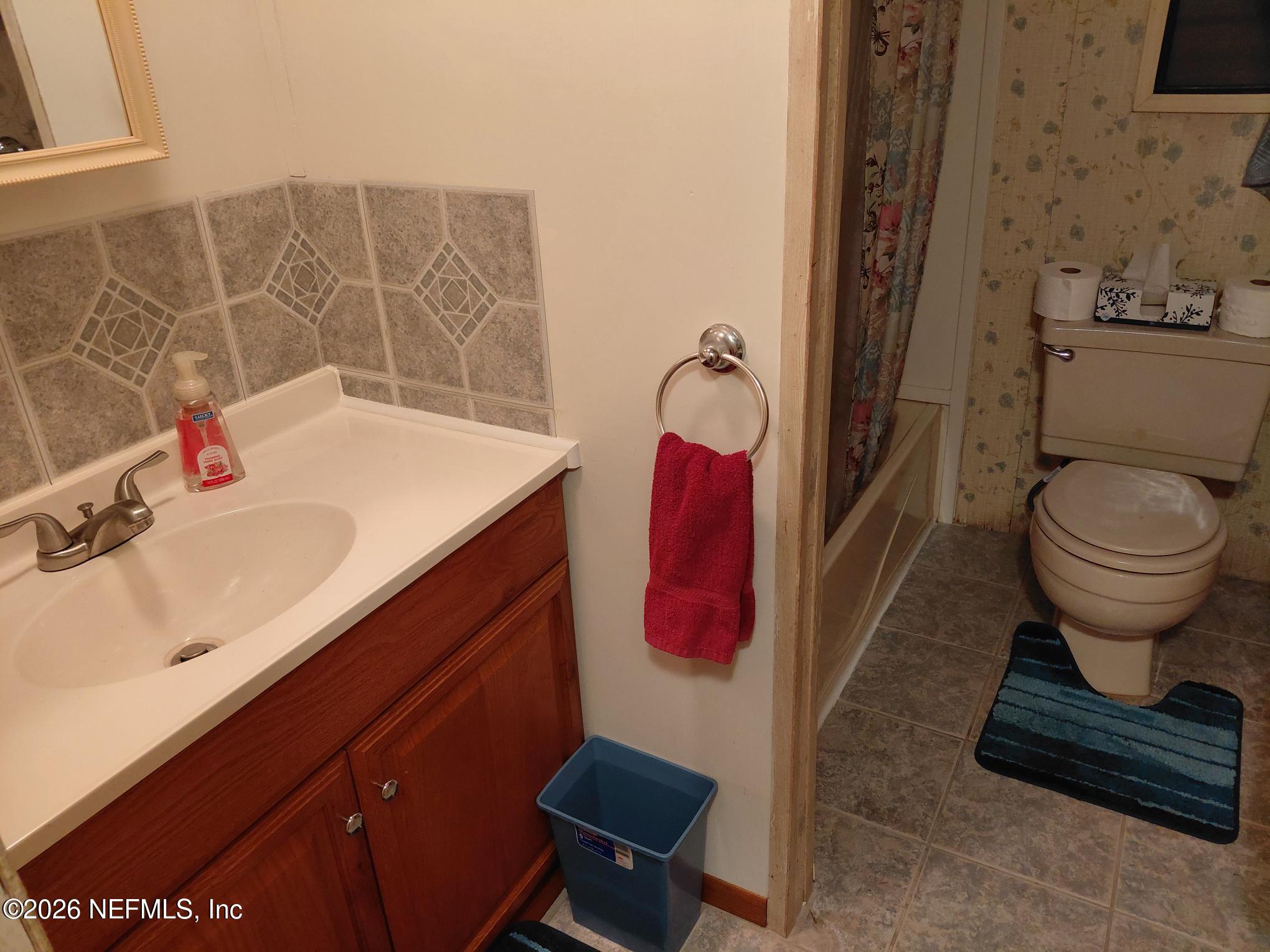 147 Jaffa Road Crescent City, FL 32112 - Photo 17 of 19 a bathroom with a sink toilet and shower