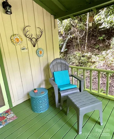 a view of a chairs and table on the deck