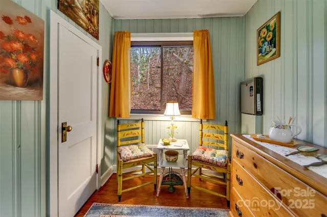 a balcony with furniture and a garden