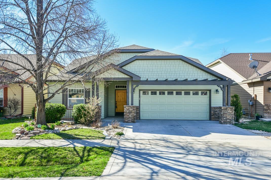 727 West Sedgewick Street Meridian, ID 83646 - Photo 1 of 30 Craftsman inspired home featuring stone siding, an attached garage, concrete driveway, a front lawn, and a shingled roof