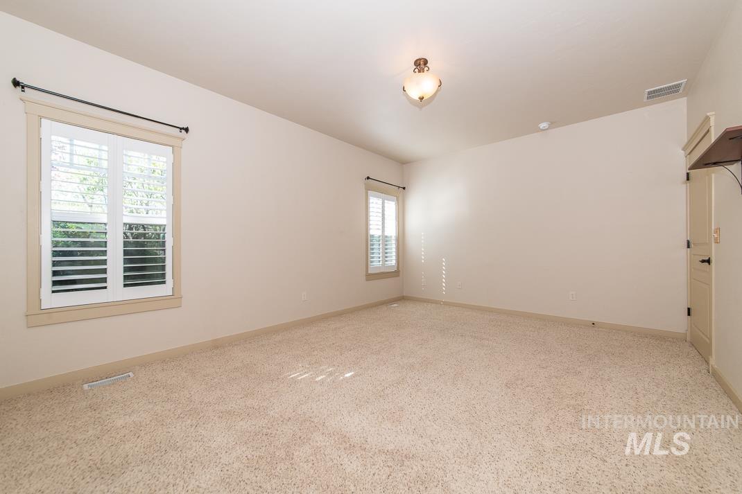727 West Sedgewick Street Meridian, ID 83646 - Photo 13 of 30 Unfurnished room with light colored carpet and baseboards