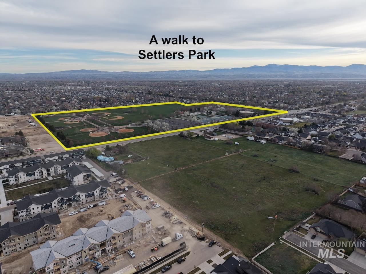 727 West Sedgewick Street Meridian, ID 83646 - Photo 27 of 30 Aerial perspective of suburban area featuring a mountain backdrop and property boundaries highlighted