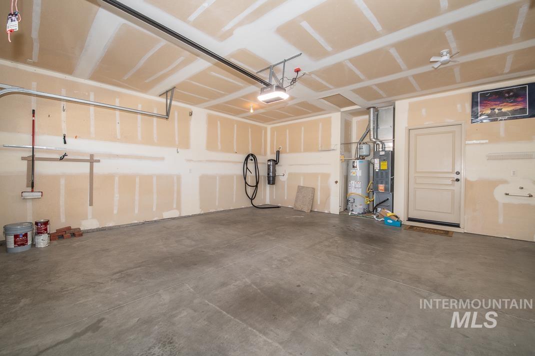727 West Sedgewick Street Meridian, ID 83646 - Photo 30 of 30 Garage featuring gas water heater and a garage door opener