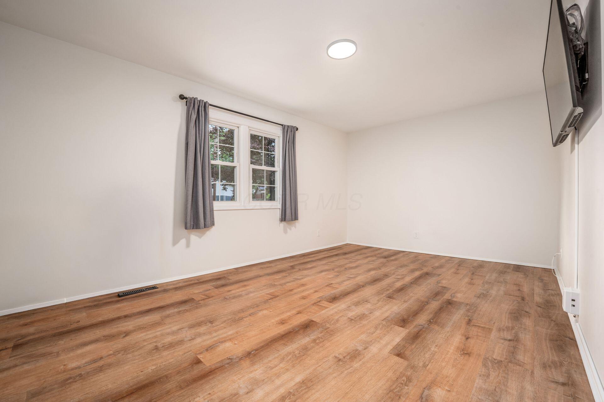 3464 Brazzaville Road Westerville, OH 43081 - Photo 13 of 46 Large living room with windows facing back ard