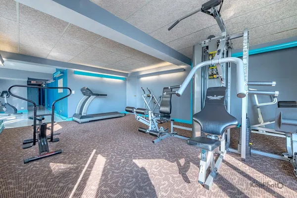 a view of a room with gym equipment