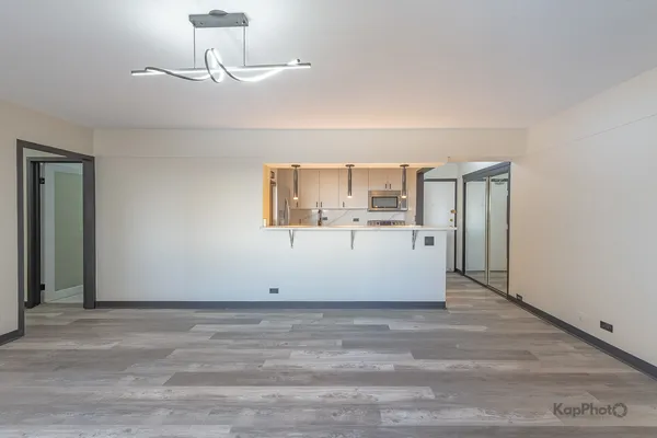 a view of a room with a cabinet and mirror
