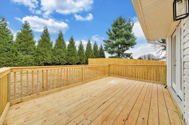 a view of balcony with wooden floor