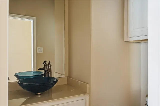 a view of a pathway with a wooden fence