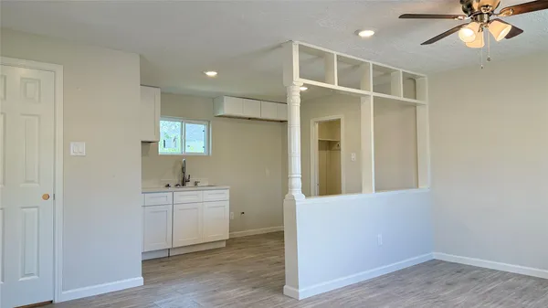 a view of bathroom with a sink and a mirror