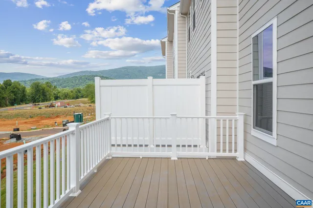a view of a balcony with wooden floor