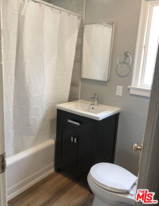 1229 West 36th Place Los Angeles, CA 90007 - Photo 4 of 8 a bathroom with a sink and a mirror