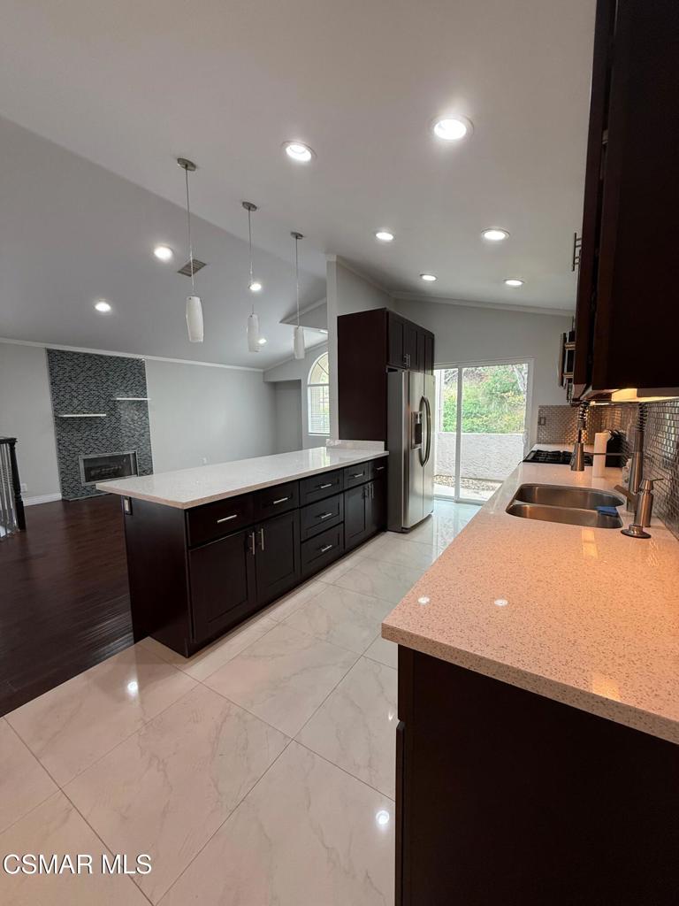 11346 Old Ranch Circle Chatsworth, CA 91311 - Photo 12 of 18 a large kitchen with stainless steel appliances a large counter top
