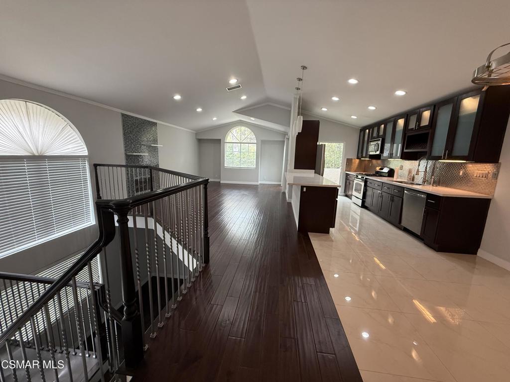 11346 Old Ranch Circle Chatsworth, CA 91311 - Photo 14 of 18 a view of kitchen with kitchen island wooden floor center island stainless steel appliances wooden floor and windows