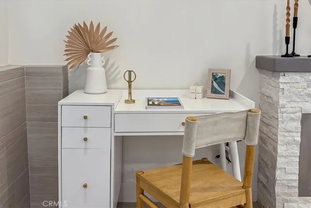 a kitchen with a stove and a potted plant