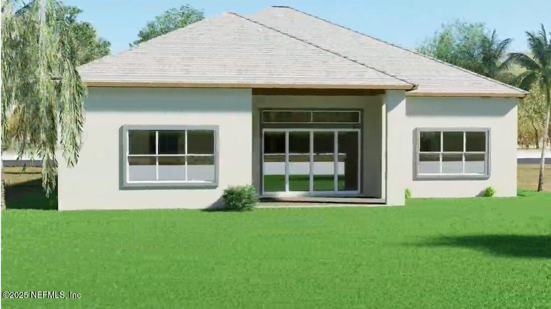 116 Longview Way North Palm Coast, FL 32137 - Photo 13 of 32 a front view of a house with a garden and yard