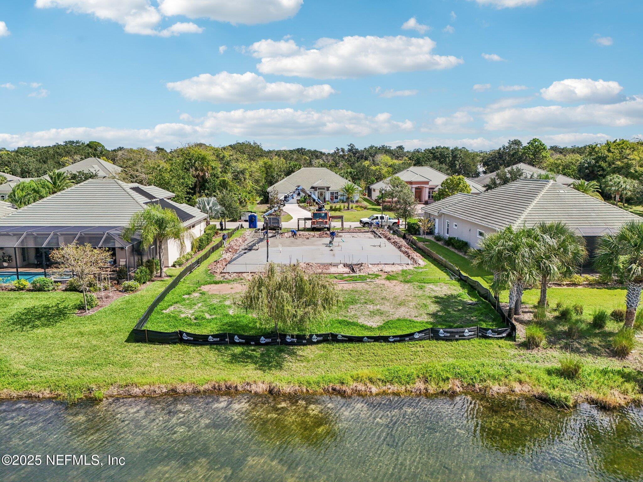 116 Longview Way North Palm Coast, FL 32137 - Photo 16 of 32 an aerial view of residential houses with outdoor space and trees