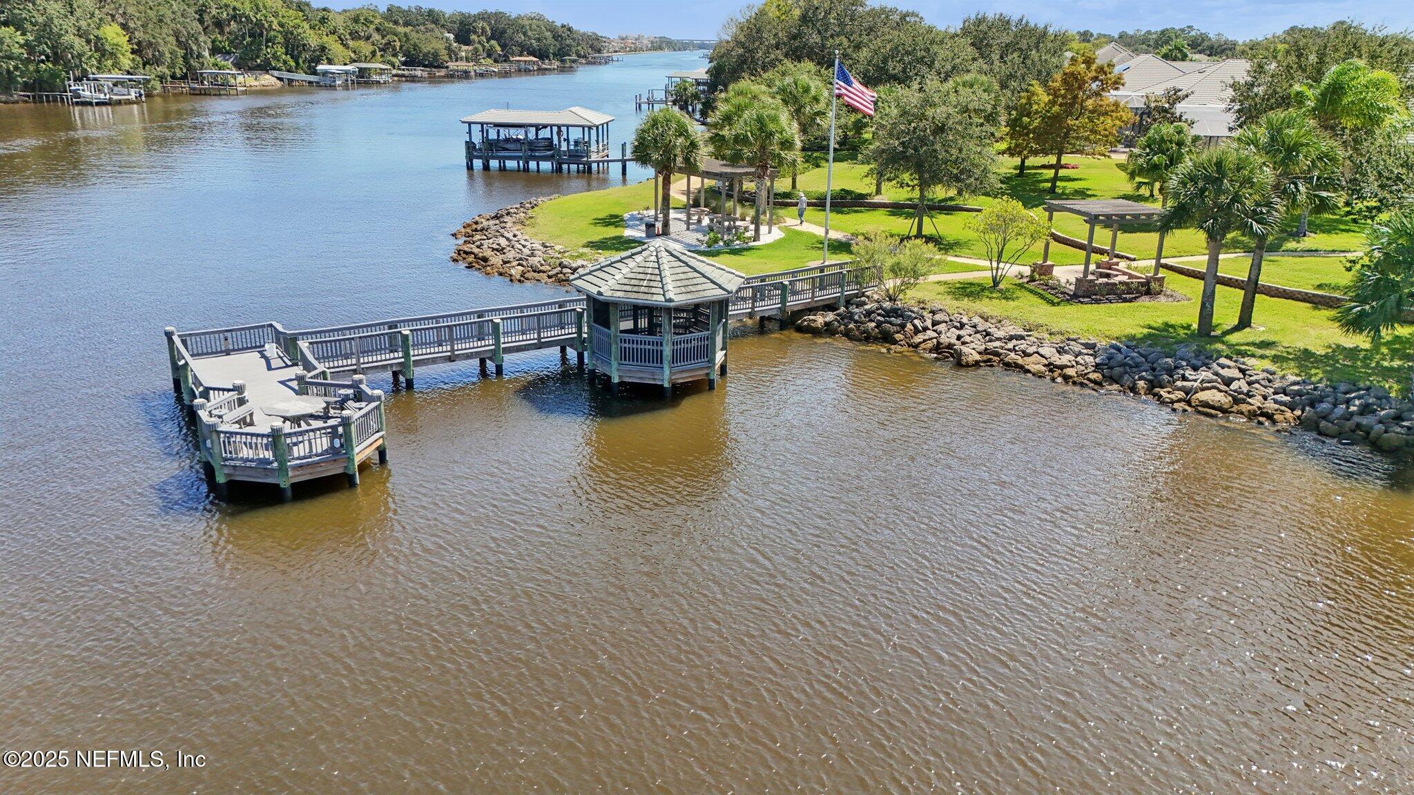 116 Longview Way North Palm Coast, FL 32137 - Photo 28 of 32 a swimming pool with outdoor seating and lake view
