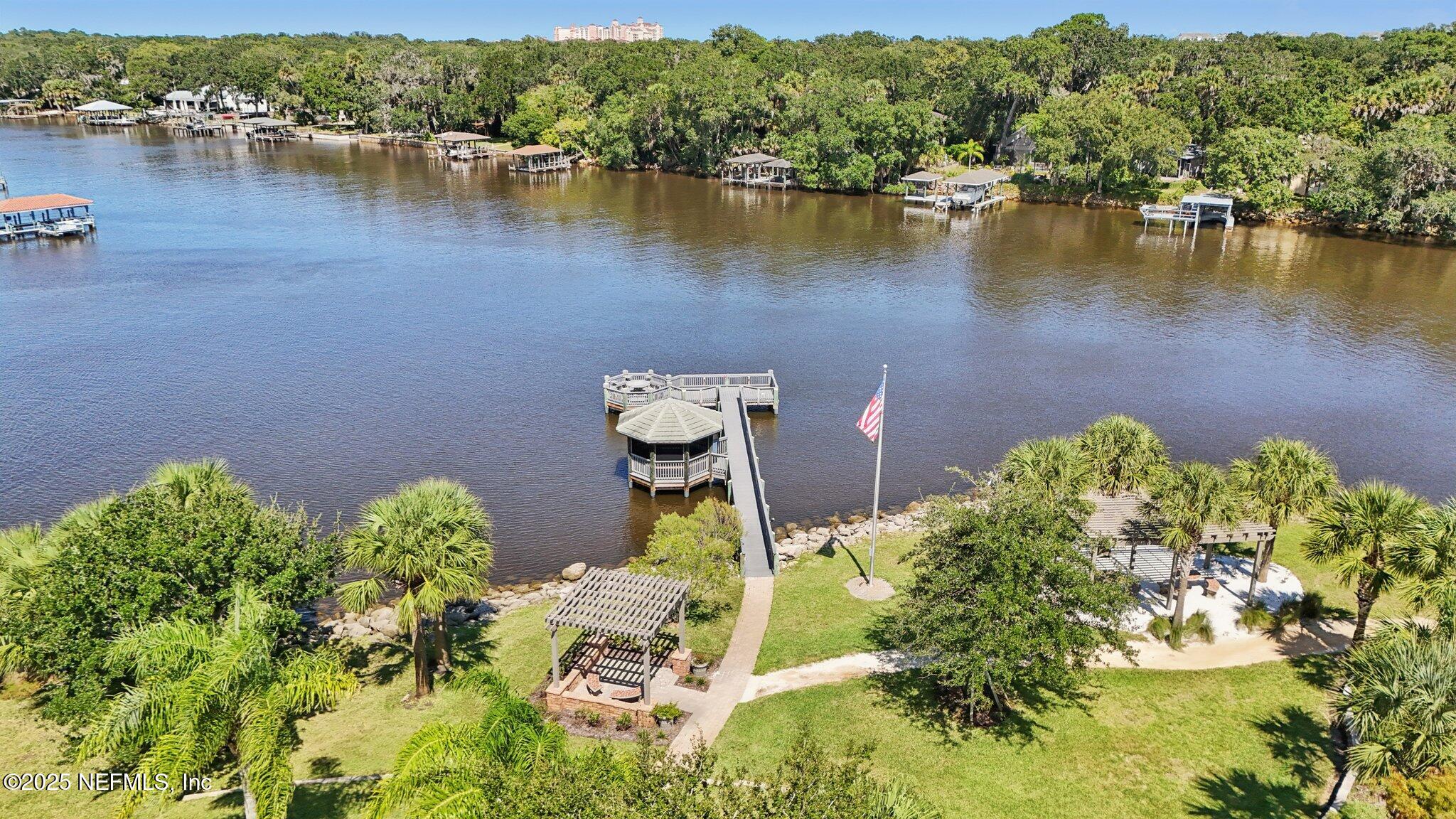 116 Longview Way North Palm Coast, FL 32137 - Photo 30 of 32 an aerial view of a house with a yard and lake view