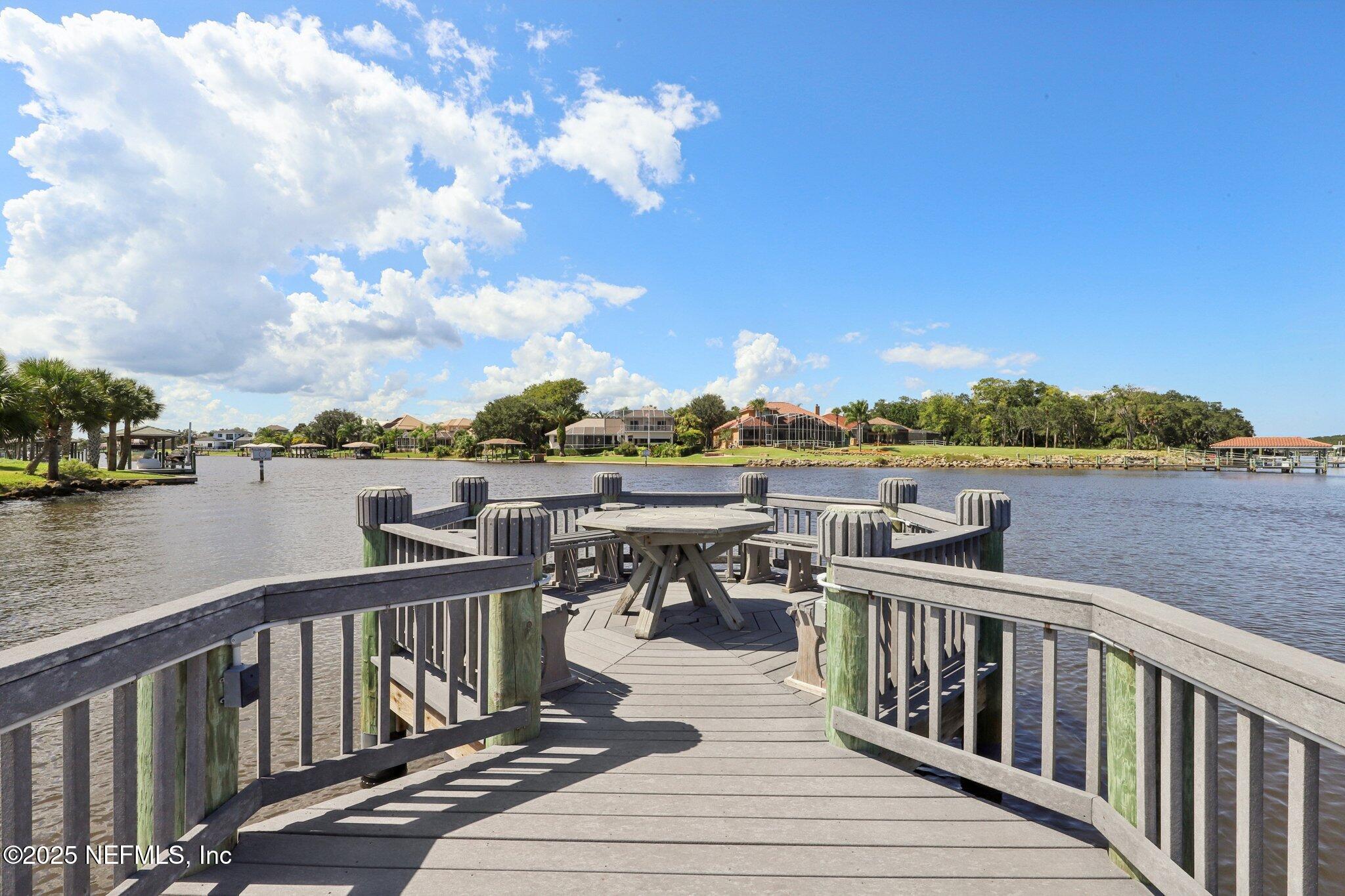 116 Longview Way North Palm Coast, FL 32137 - Photo 32 of 32 a view of a lake with boats and trees in the background