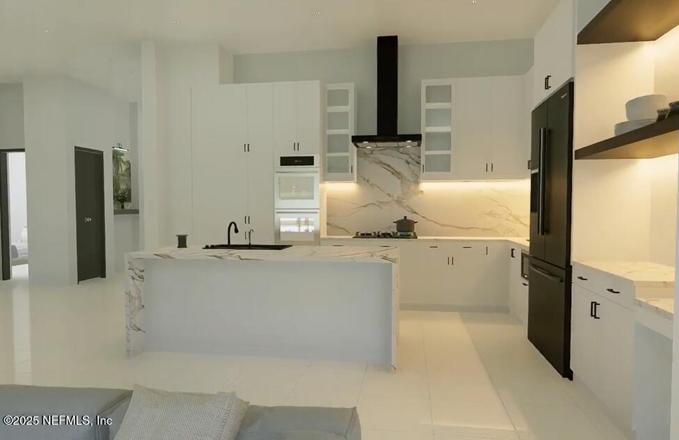 116 Longview Way North Palm Coast, FL 32137 - Photo 4 of 32 a kitchen with a sink and a refrigerator