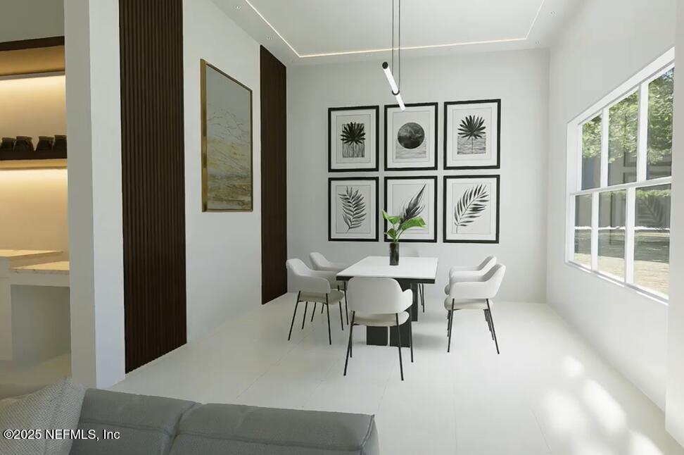 116 Longview Way North Palm Coast, FL 32137 - Photo 7 of 32 a dining room with furniture a painting and a potted plant