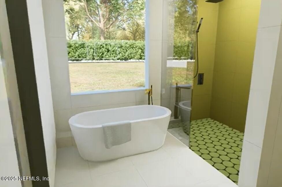 116 Longview Way North Palm Coast, FL 32137 - Photo 9 of 32 a white bath tub sitting in a bathroom next to a window