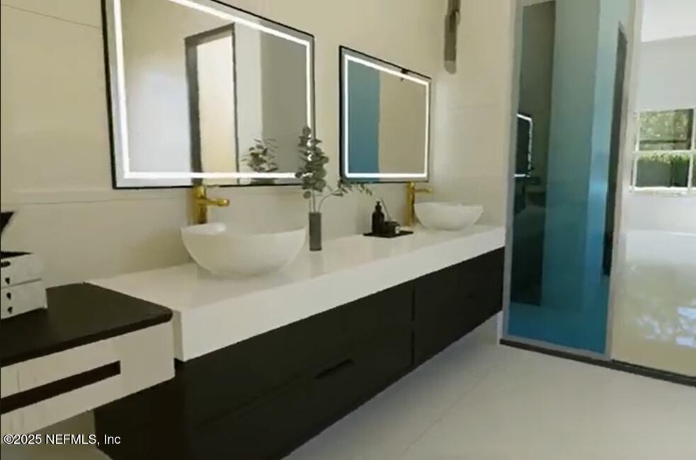 116 Longview Way North Palm Coast, FL 32137 - Photo 10 of 32 a bathroom with a sink and a mirror