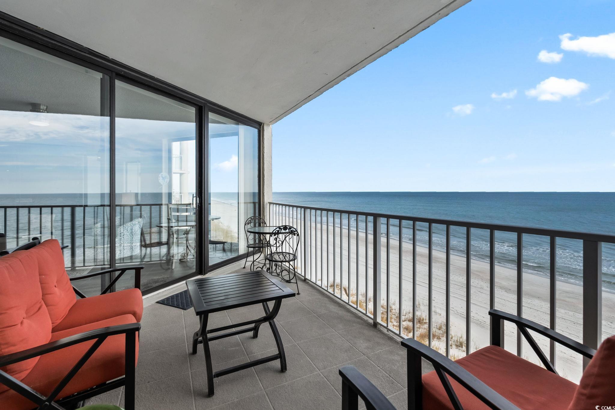 1990 North Waccamaw Drive, Unit 403 Murrells Inlet, SC 29576 - Photo 2 of 39 Balcony featuring view of water and beach