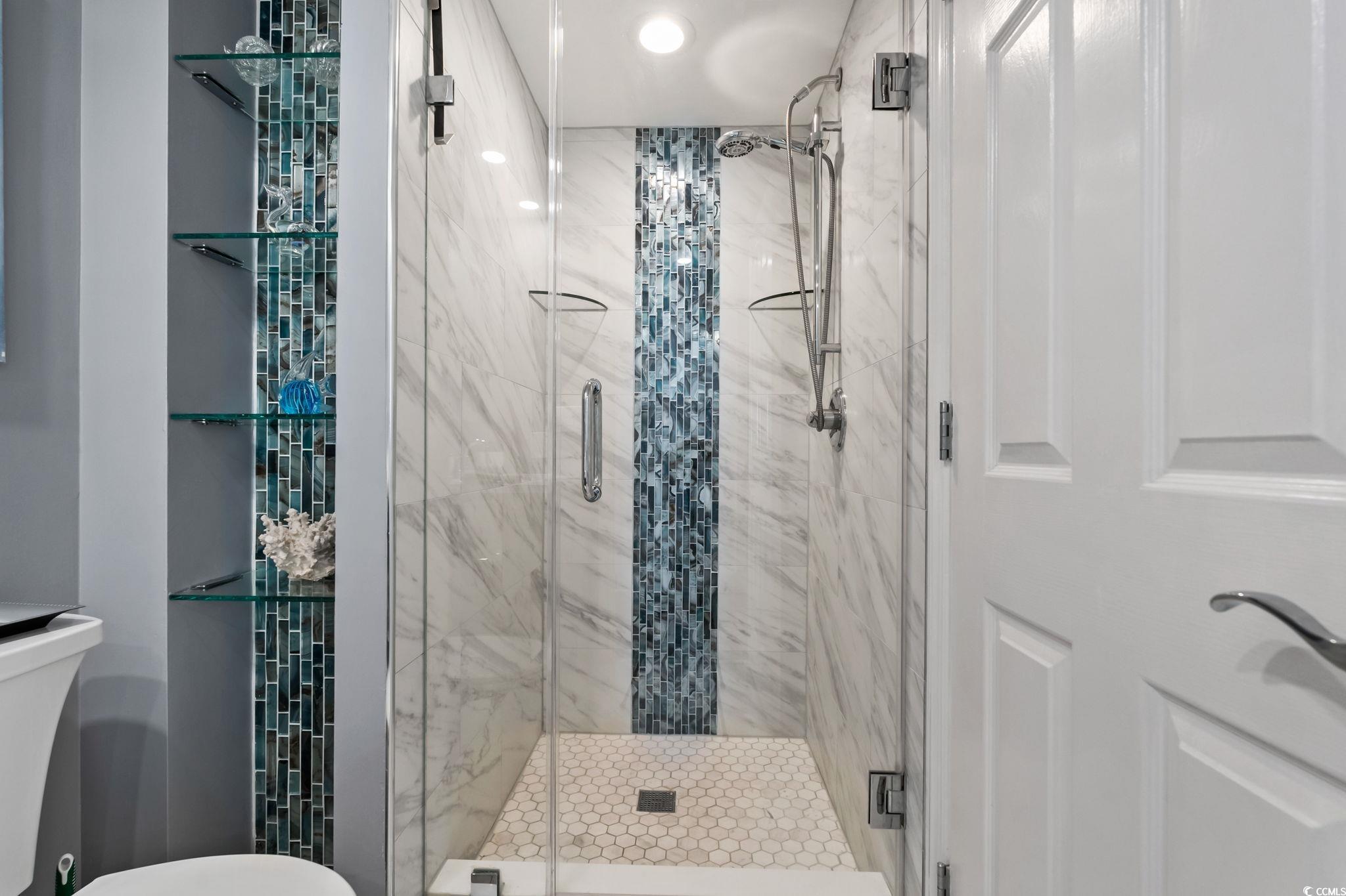 1990 North Waccamaw Drive, Unit 403 Murrells Inlet, SC 29576 - Photo 29 of 39 Full bathroom featuring a marble finish shower and toilet