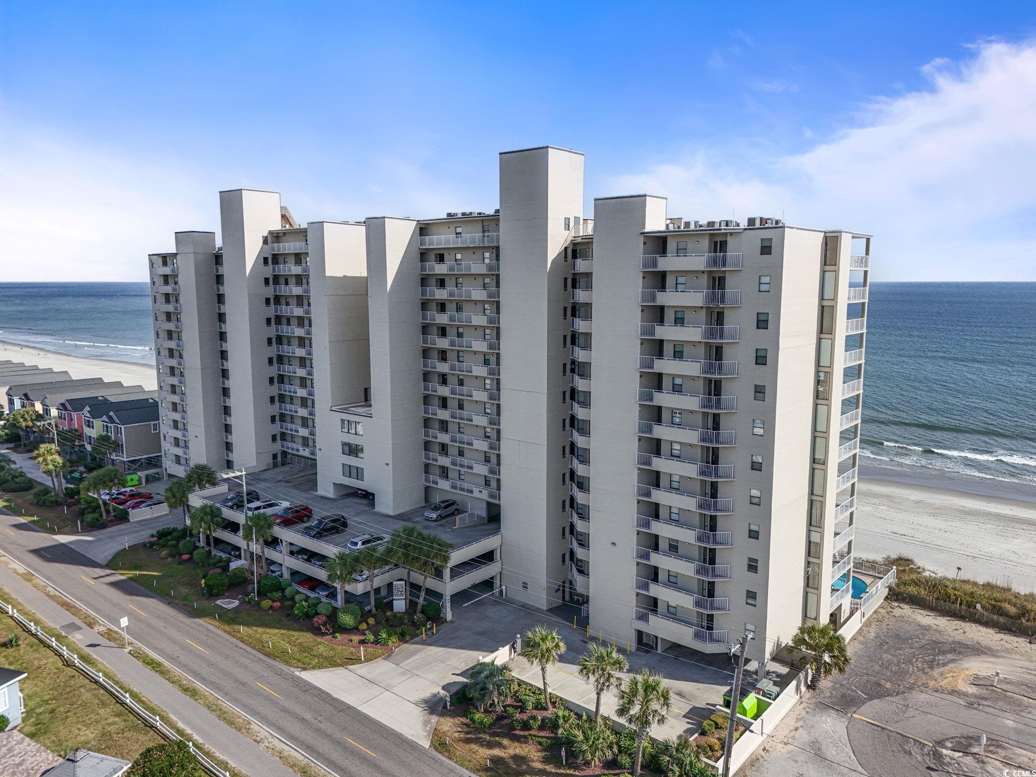 1990 North Waccamaw Drive, Unit 403 Murrells Inlet, SC 29576 - Photo 31 of 39 View of apartment building / complex with view of water and beach