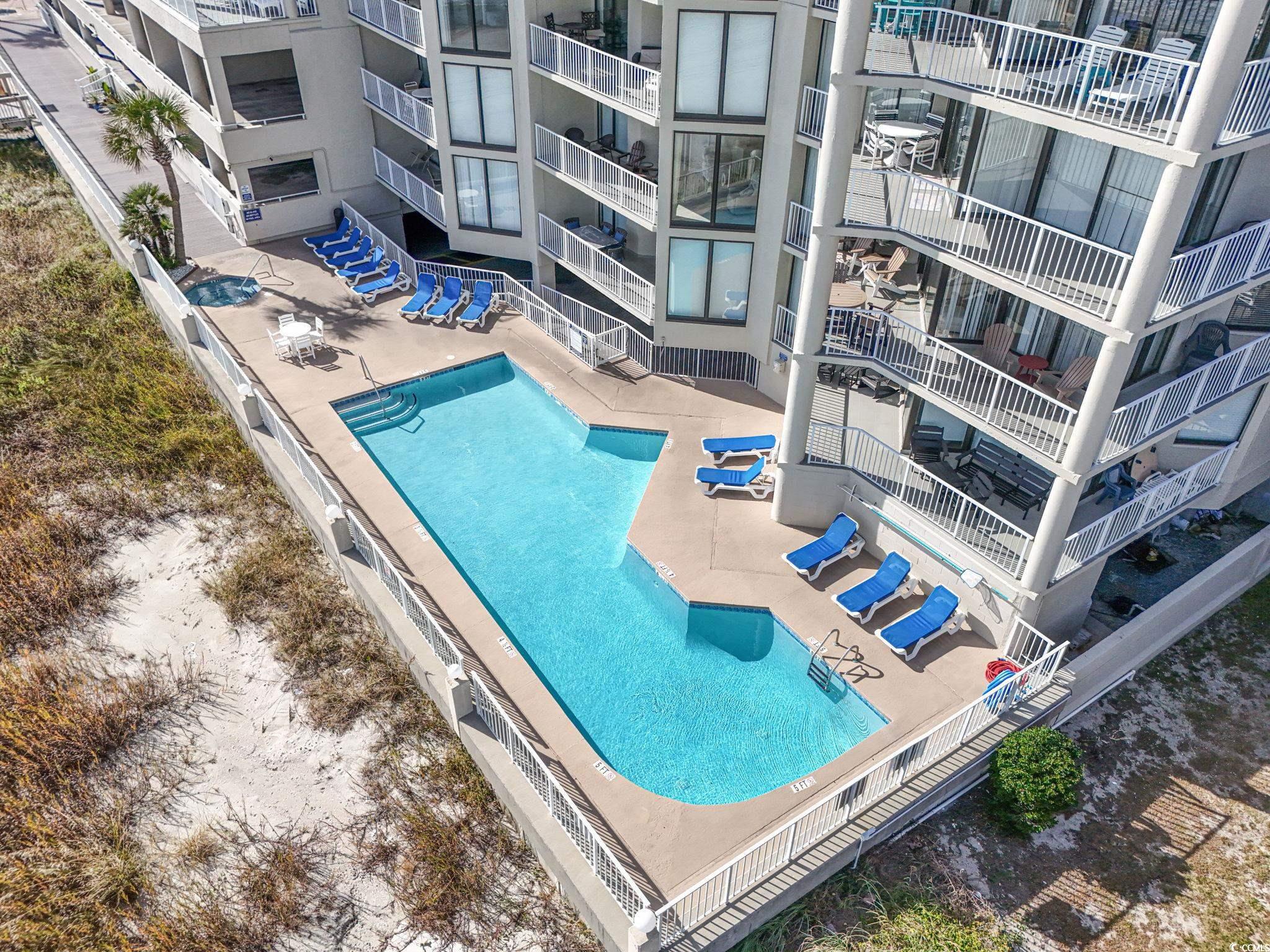1990 North Waccamaw Drive, Unit 403 Murrells Inlet, SC 29576 - Photo 35 of 39 Community pool with a patio